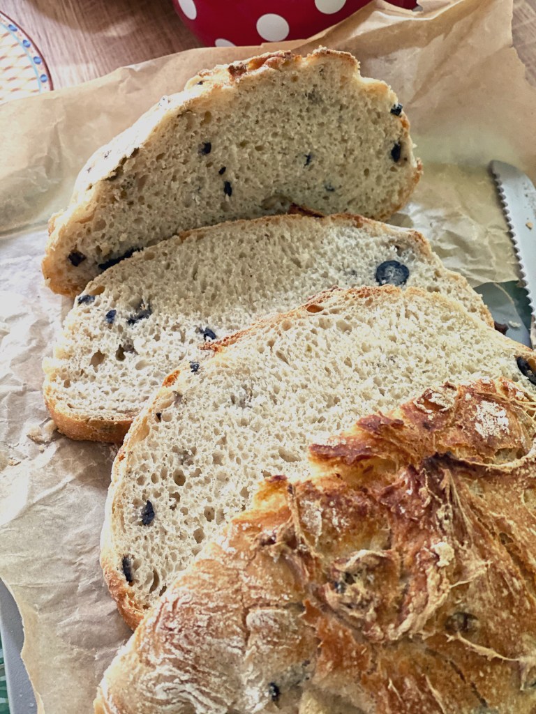 Handmade artisan bread with mixed olives